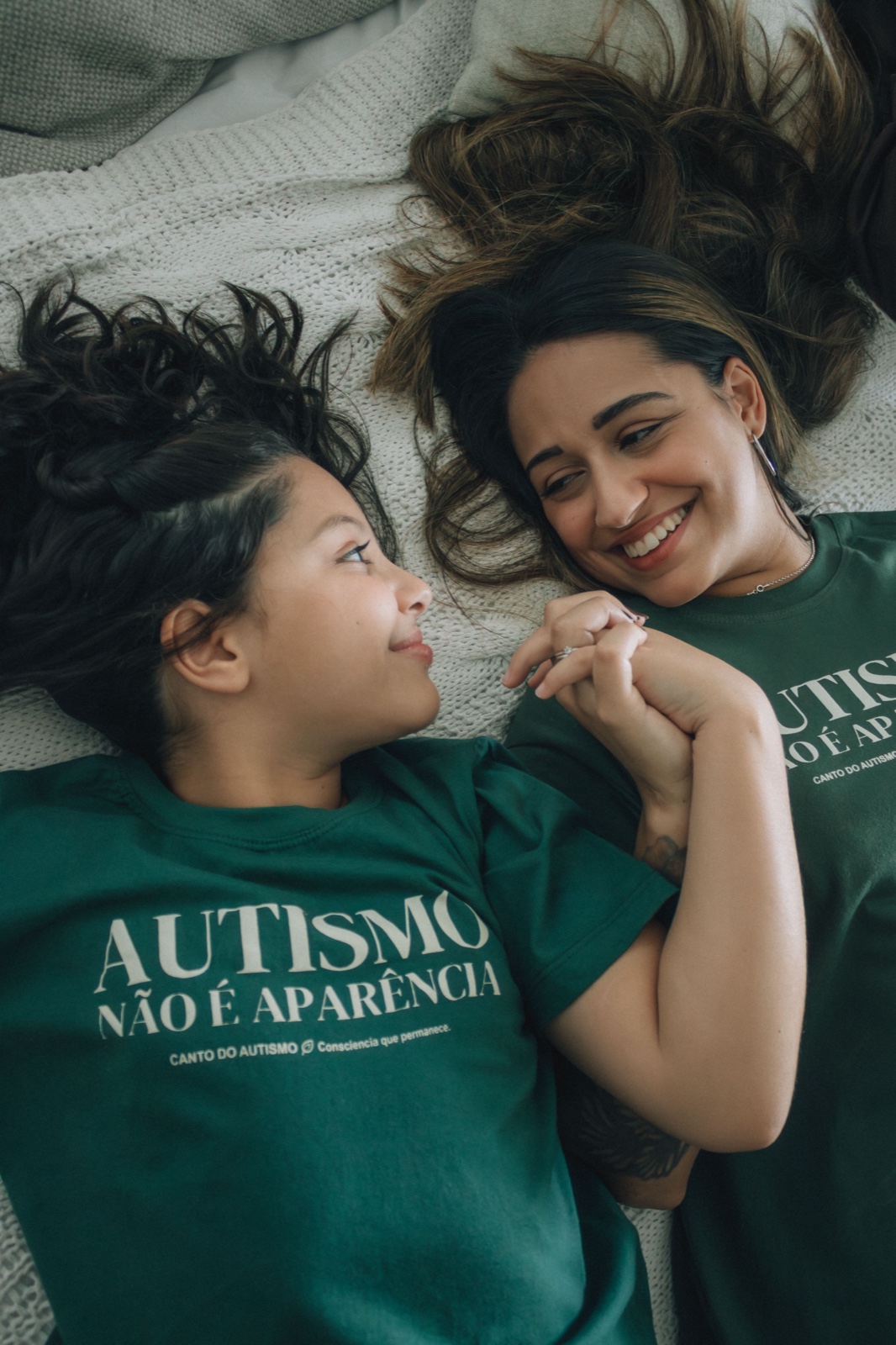 A mother and her daughter smiling at each other